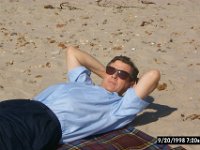 Feeling So Relaxed  Dad lays back on the blanket to take in the sun