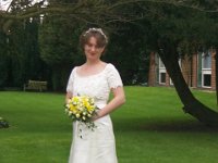 Blushing Bride  Claire takes photos on the beautiful lawn but it was absolutely freezing outside!