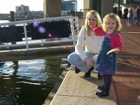 Feeding the Ducks  Chloe throws bread into the water for the ducks in the Baltimore Harbor