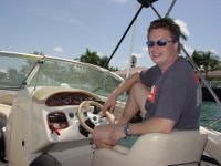 A Happy Man!  One of Andy's favorite places is behind the wheel of his boat!