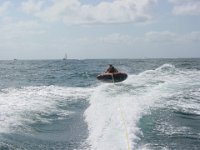 In Mid Air!  Adam goes flying in the air when Andy turns the boat!