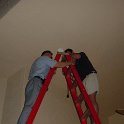 Men on Ladder  Dad & Steve attempt to work on the lighting outside...wow, it's high up there!