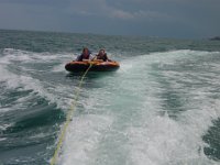 Who Will Fall First?  Andy drives the boat fast to try & make Shavaugn & Andy H. come off the tube!