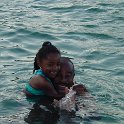 Daddy's Little Girl  Mia grabs onto her daddy while swimming at Peanut Island