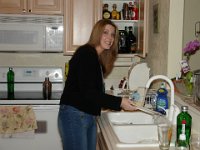 Cleaning Up  Sheri tries to clean the dishes