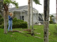 Sheri looking at the damage  Our neighbors screen was damaged