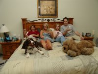 5 on the bed  Watching a movie in our bedroom with 3 friends who stayed with us to share our generator and food from the evening of the hurricane until Thurday when they got power back in their homes