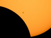 2017 Total Solar Eclipse - ISS Transit  The International Space Station, with a crew of six onboard, is seen in silhouette as it transits the Sun at roughly five miles per second during a partial solar eclipse, Monday, Aug. 21, 2017 from Ross Lake, Northern Cascades National Park, Washington.  Onboard as part of Expedition 52 are: NASA astronauts Peggy Whitson, Jack Fischer, and Randy Bresnik; Russian cosmonauts Fyodor Yurchikhin and Sergey Ryazanskiy; and ESA (European Space Agency) astronaut Paolo Nespoli. A total solar eclipse swept across a narrow portion of the contiguous United States from Lincoln Beach, Oregon to Charleston, South Carolina. A partial solar eclipse was visible across the entire North American continent along with parts of South America, Africa, and Europe.  Photo Credit: (NASA/Bill Ingalls) : International Space Station (ISS), Northern Cascades National Park, Partial Solar Eclipse, Places, Ross Lake, Sun, Transit, Washington