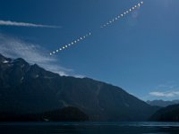 2017 Total Solar Eclipse  This composite image shows the progression of a partial solar eclipse over Ross Lake, in Northern Cascades National Park, Washington on Monday, Aug. 21, 2017. A total solar eclipse swept across a narrow portion of the contiguous United States from Lincoln Beach, Oregon to Charleston, South Carolina. A partial solar eclipse was visible across the entire North American continent along with parts of South America, Africa, and Europe.  Photo Credit: (NASA/Bill Ingalls) : Northern Cascades National Park, Ross Lake, Sun, Total Solar Eclipse